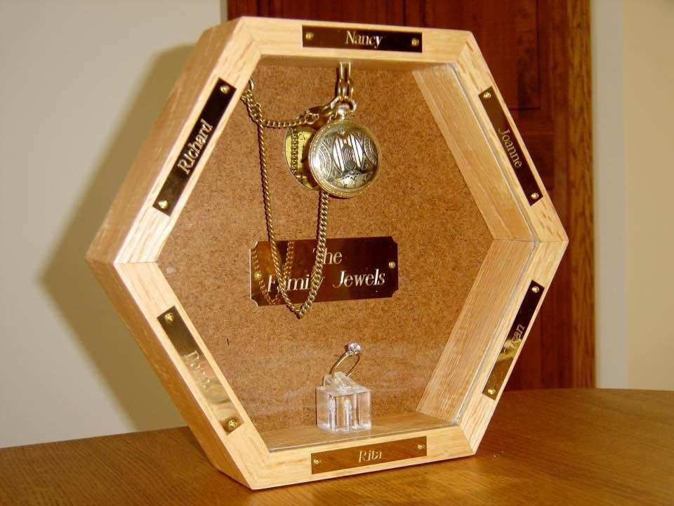 This is something that my brother Richard made about 12 years ago. It is our "Family Jewels." It contains my Dad's pocket watch and my Mom's engagement ring. It gets sent to you every year for your birthday. Today would