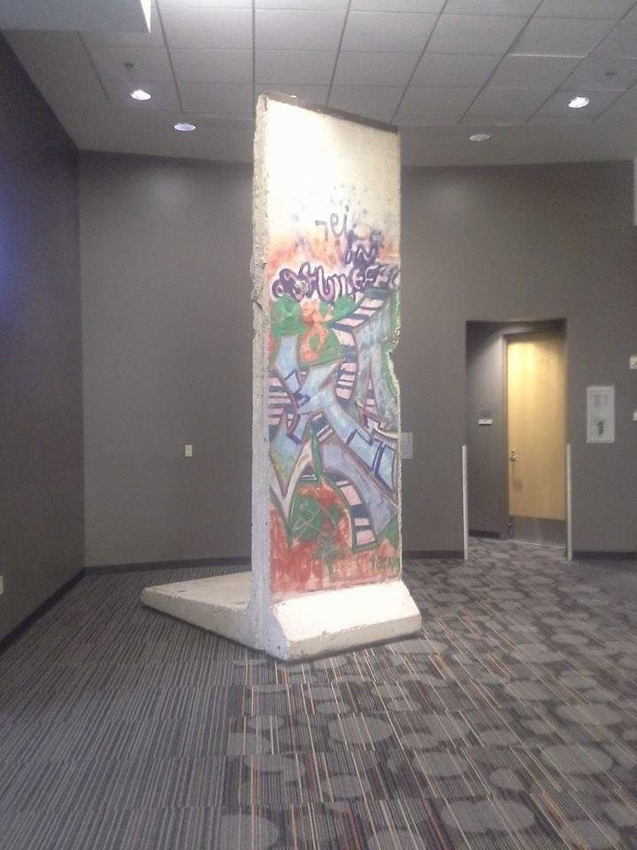 Yes, that is a real piece of the Berlin wall.