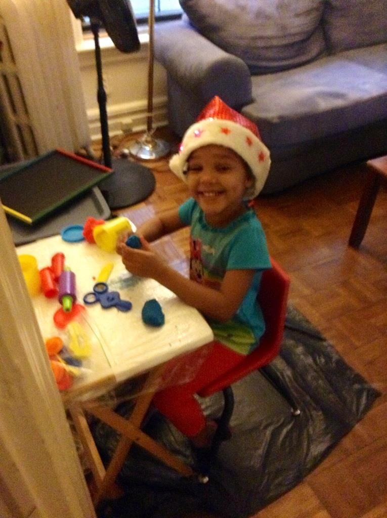 My lil angel play with one of her gifts,she must love a lot cause she has other gifts that are unwrapped but not opened.