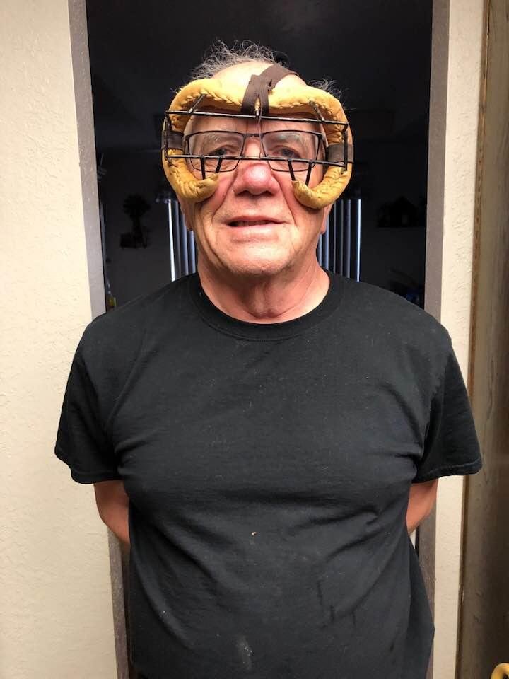 Rick trying on his gear for baseball