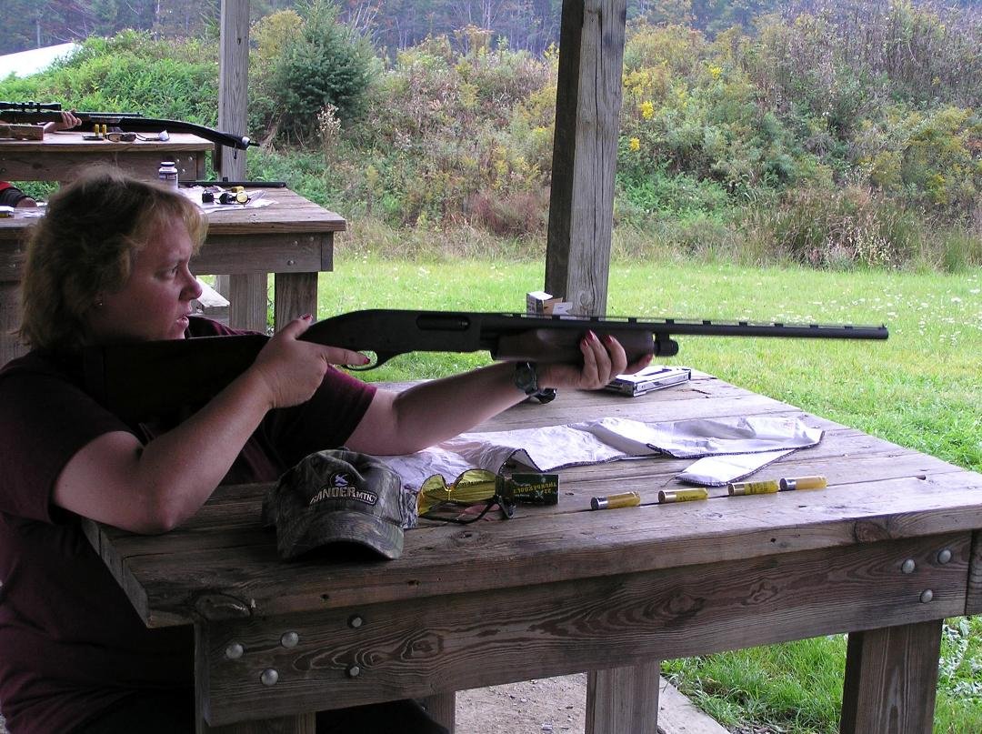 betsy at the shooting range using the shot gun