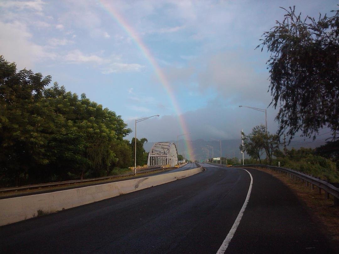 Rainbow over Anasco Bridge. Got this shot while riding my bike at 7:00am Sunday morning on my way to Rincon