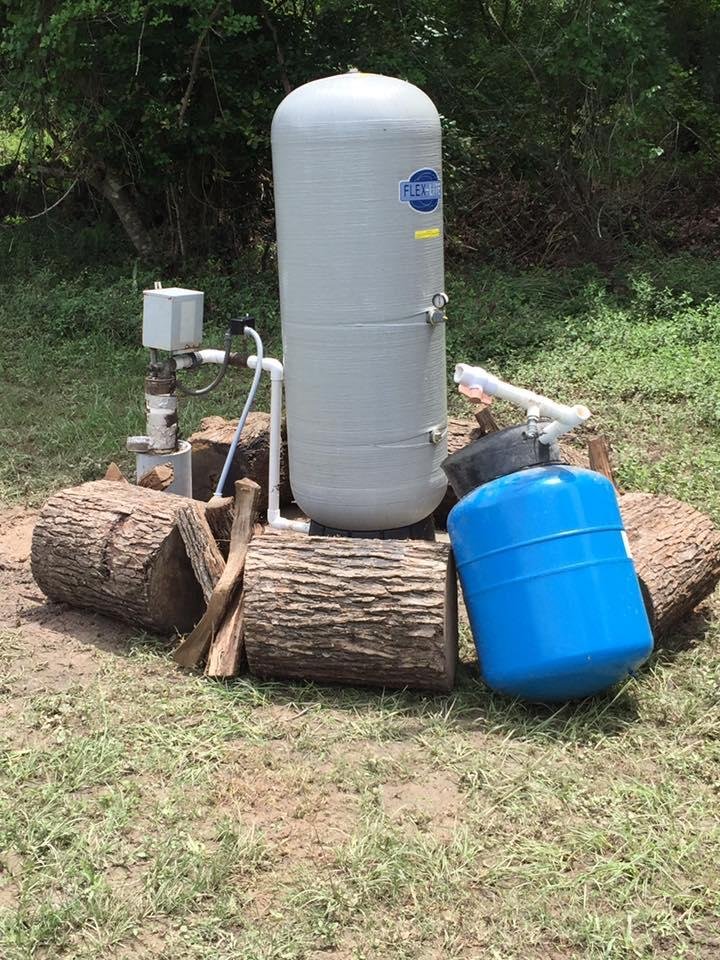 Water well fixed and back in service. Ain't she pretty? She better be after cost. The blue one in the pic is the old well saver that got knock out.