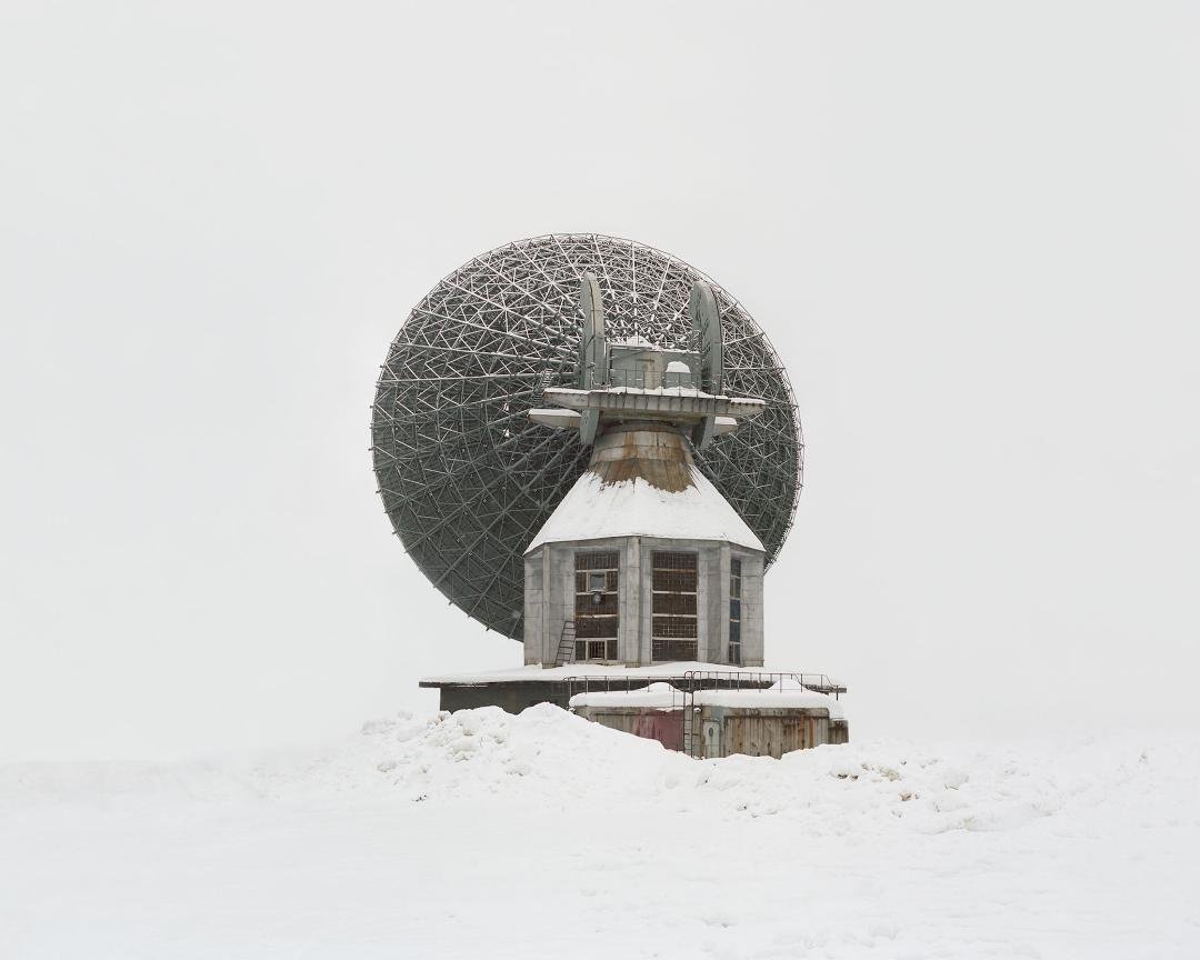 A deserted Soviet interplanetary antenna in the Arctic Arkhangelsk region, speaks particularly poignantly to the idea that it might be possible to transcend the earth altogether. Planning to build bases on other planets, th