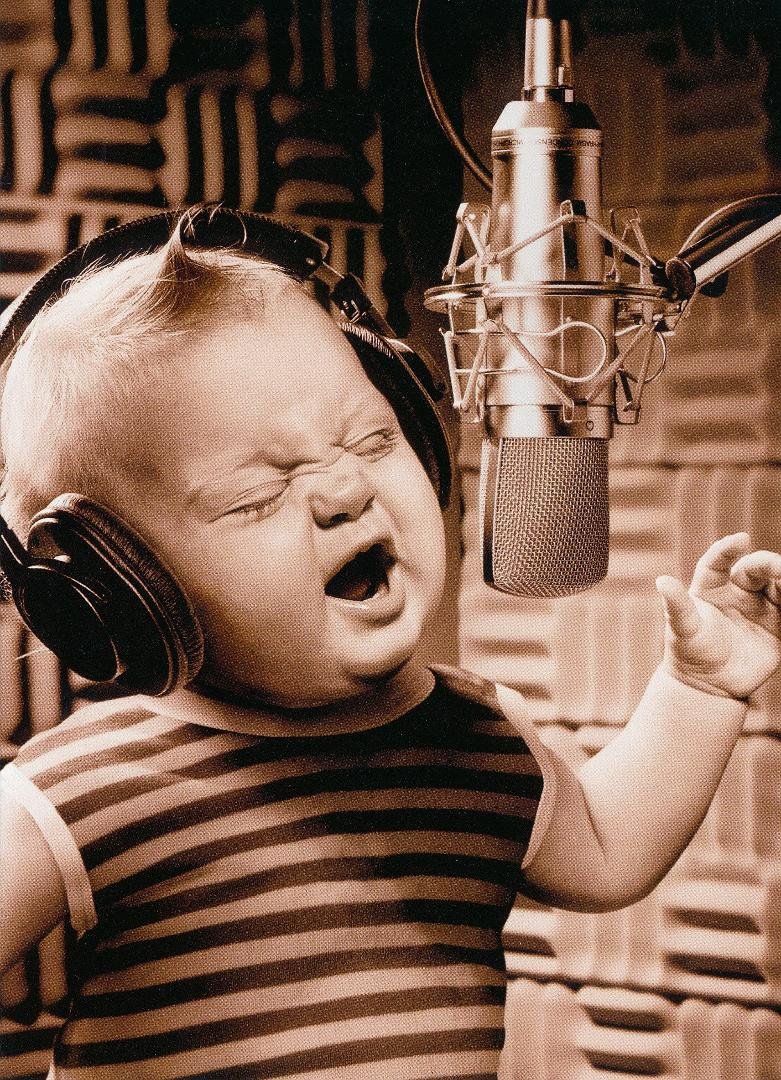Me behind the microphone at my first radio gig...pretty cool, but not cool enough to win the "CUTEST BABY CONTEST' on Magic 106.7.  Have you submitted a picture of your baby?  Entry deadline is Sunday August 12th at 11:59 P