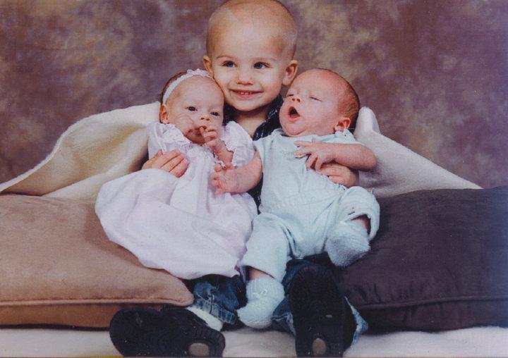 Big brother Cory with Twins Daisy and Charles.