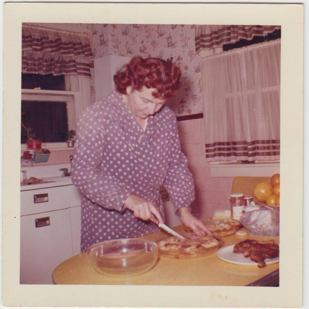 Circa 1950s. Note kitchen decor. Mom was heavier at this time.