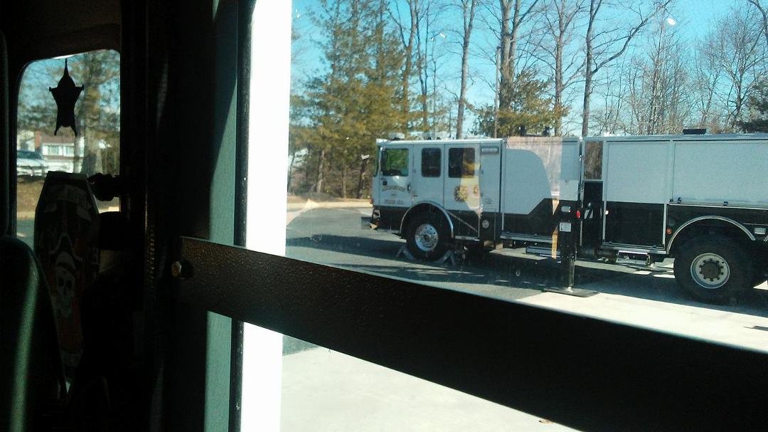 I get to ride on the big fire truck. (Our new ladder truck taken from inside Engine 414.)