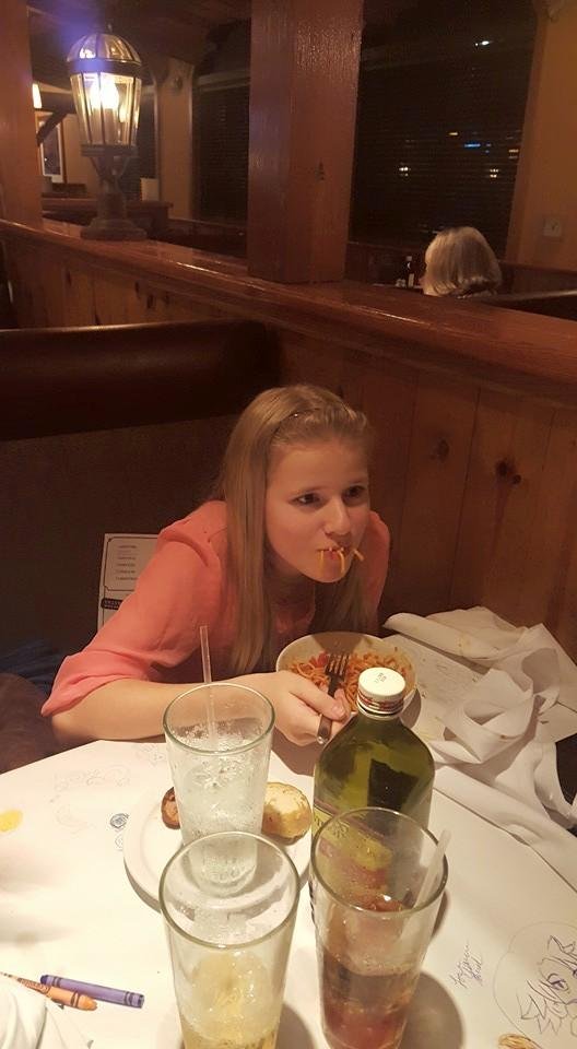 Emma feasting on her Birthday dinner at Macaroni Grill