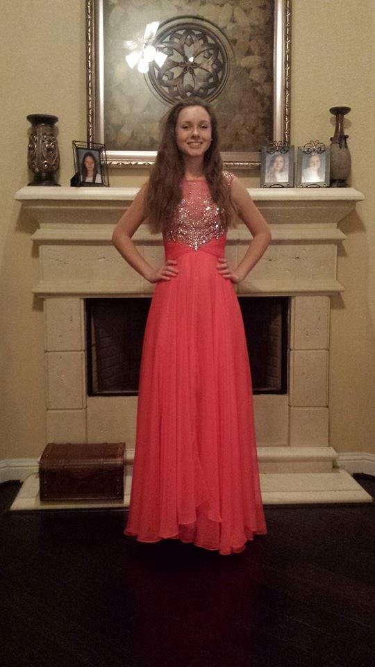 Our beautiful grand daughter Brooke, in her prom dress. To fast they grow up. Grand children are one of the most wonderful things that happens in your life . Enjoy them while they are young.