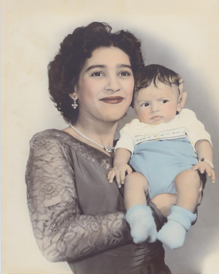 In honor of my mom on this Mother's Day. Here she is proudly holding me,