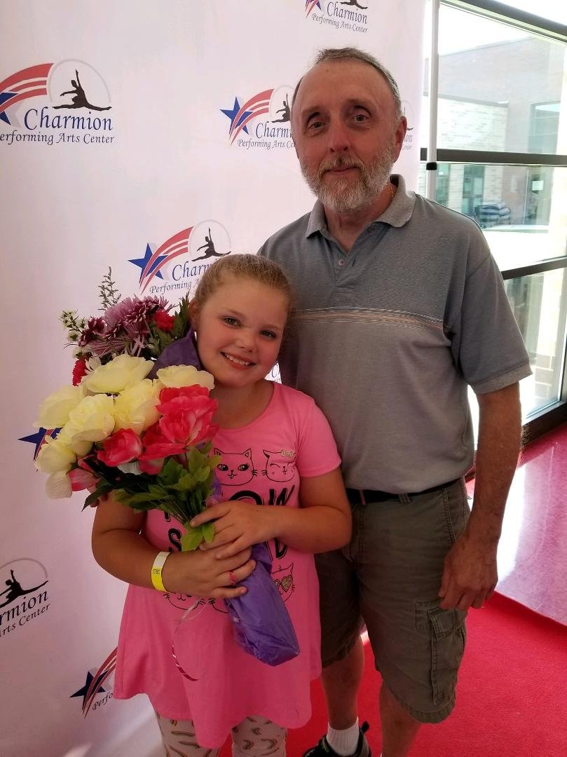 My granddaughter Hailey with Grandpa after her dance recital....