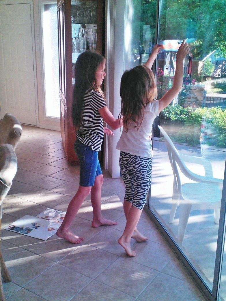 Decorating Grandma and Grandpa's windows for Hallowe'en.