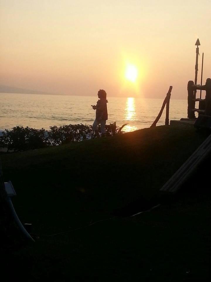 Gina took this picture of me taking sunset.