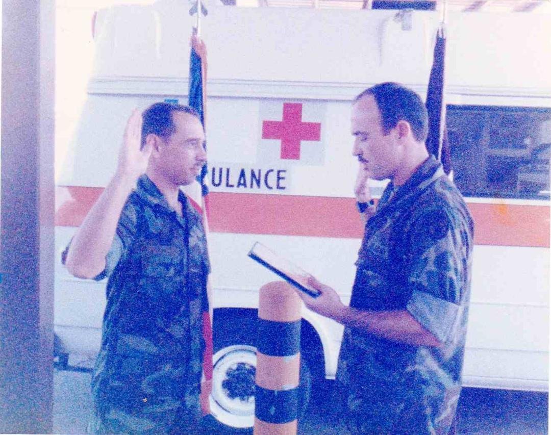 Taking the oath (Re-Enlistment), 7/11/1985, in the ambulance deck at Bliss Army Hospital, Fort Huachuca, AZ. That's my ambulance in the background.