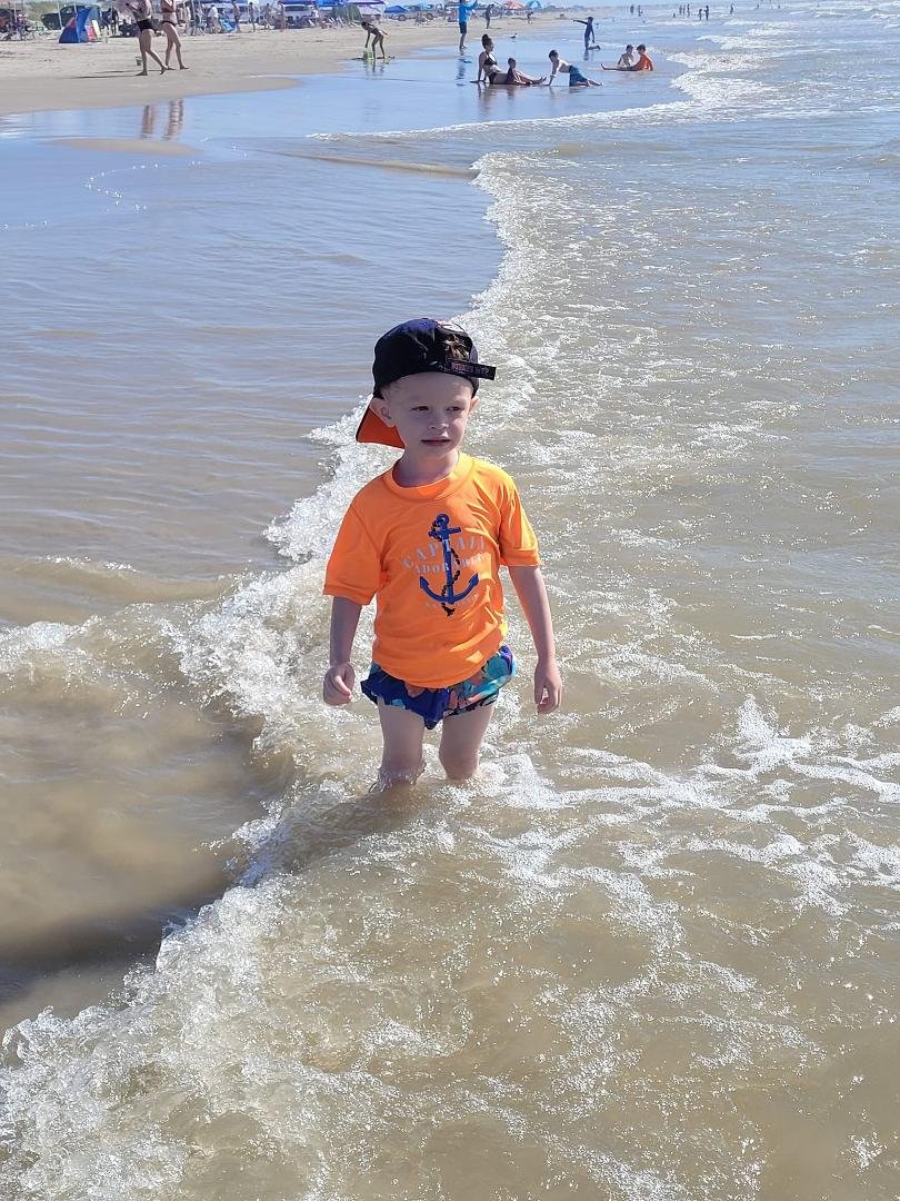 Taunting the waves to knock him down.