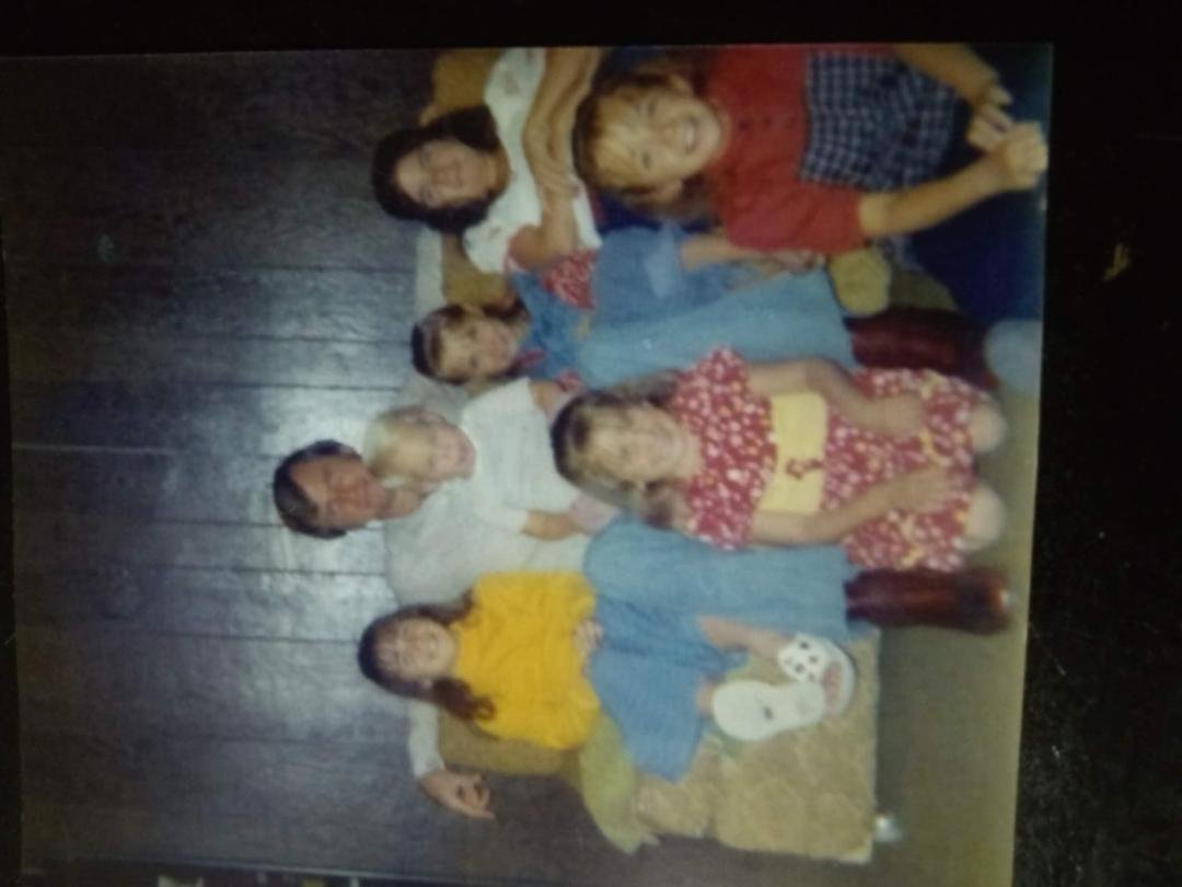 Summer of 72 in North Las Vegas Stacey age 10 sitting on floor with me above her on the couch soon will be 12 our 3 younger sisters with baby brother on our young dad age 31! Wow so long ago the age of innocence!