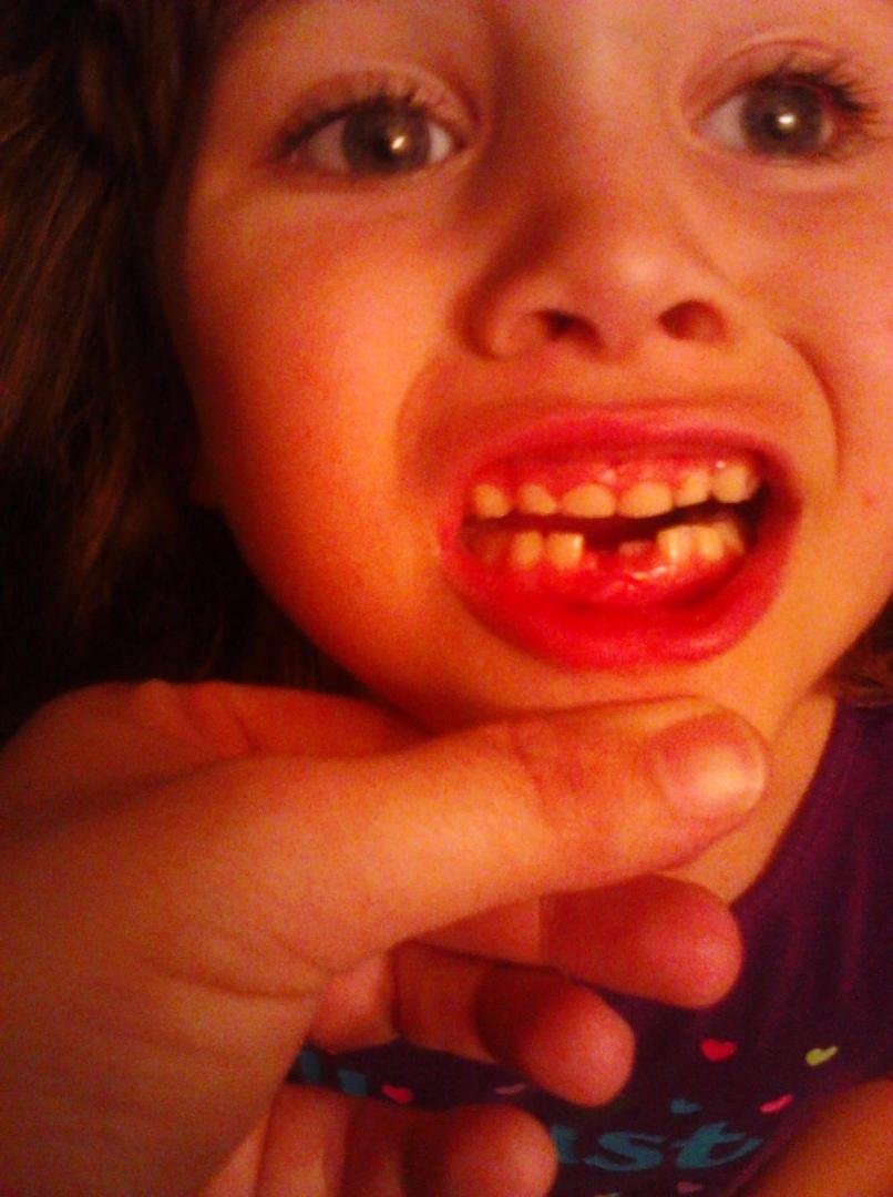 Another tooth lost....but a permanent coming in! And she informs me that she has another loose tooth on top! My baby is growing up so fast but I cherish every little moment.