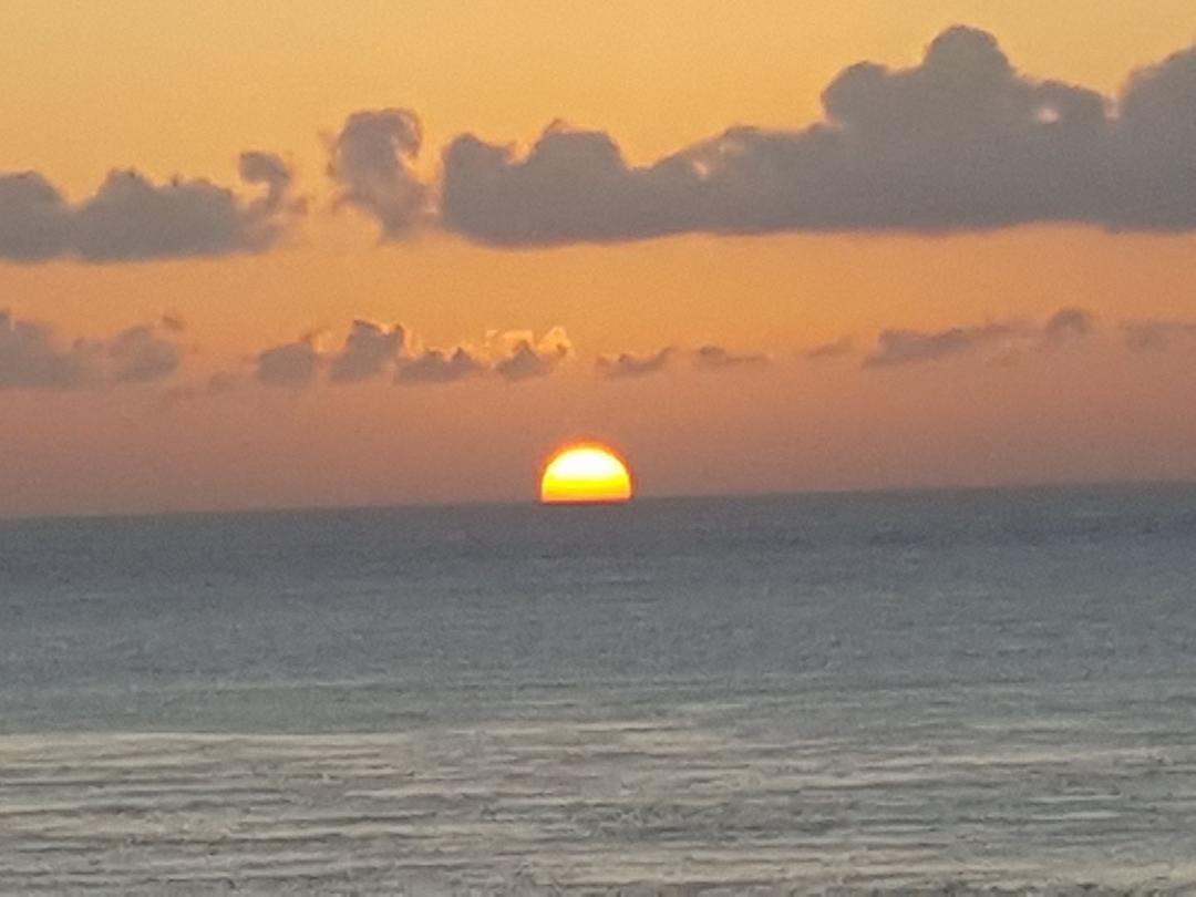 Sunset from my balcony. Leave Friday and yes, I'm wearing shorts home!!