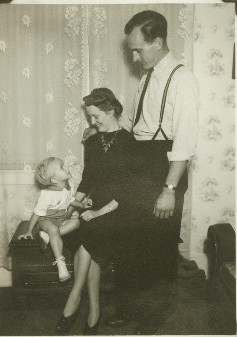 As I was the first child in a large family, this is my (happy) father 's (day) and mother and me, at age 2, in our home in Los Angeles California.