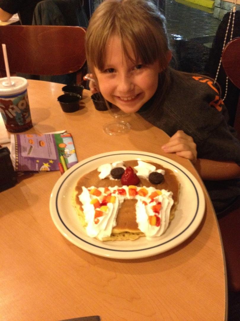 Marrion making scary face pancake at IHOP. Lobos won. 48-10 when we left. Mercy clock was running.