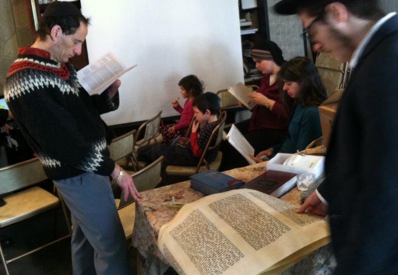 Listening to the Megillah reading at Purim. Boo haman!!!