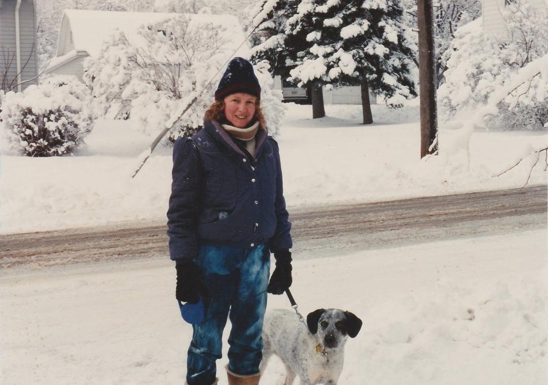 Amy with our first dog "S(tonewall) Barky Jackson". The barn in the background is no longer there, having been torn down when they split the lot to build a duplex home. Photo from 1993.