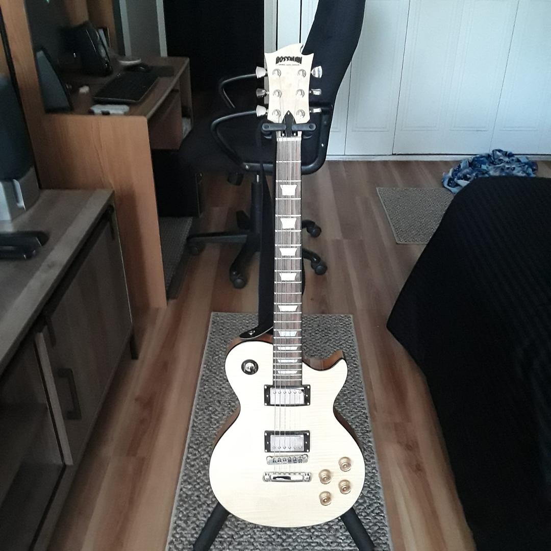 I picked up this guitar yesterday. It's a Hardluck Kings Bossman...For the woping price of 110 dollars. Solid mahogany and sounds and plays incredible.