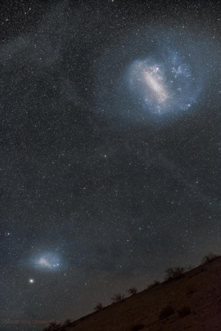 Magellanic Clouds over Chile
Image Credit & Copyright: Felipe Mac Auliffe López
Explanation: The two prominent clouds in this Chilean Atacama Desert skyscape captured on January 21 actually lie beyond our Milky Way galaxy.