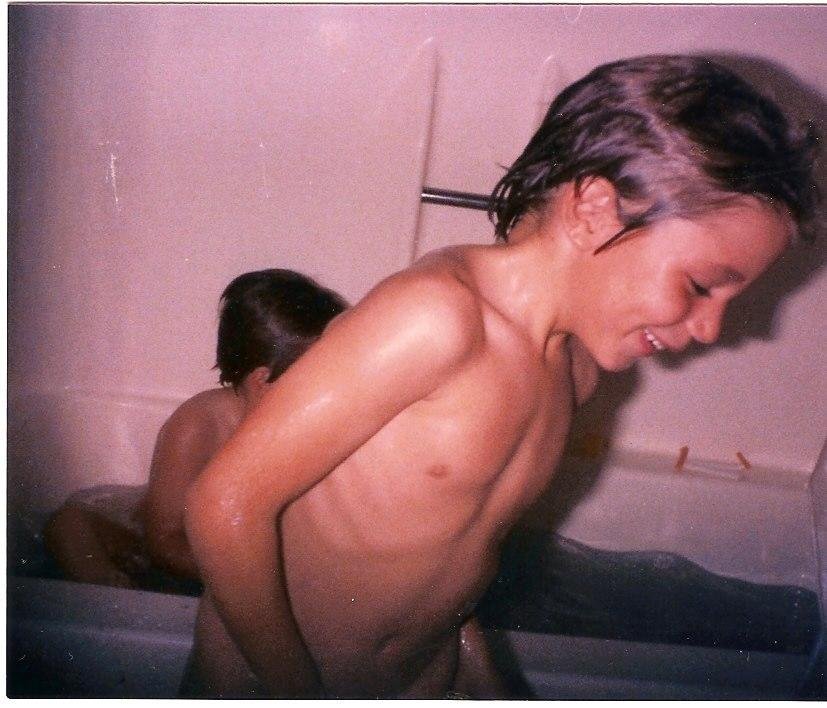 Kurt at our built in pool (Some people call it a bathtub). And he is NOT naked! He always wore swim trunks into water.