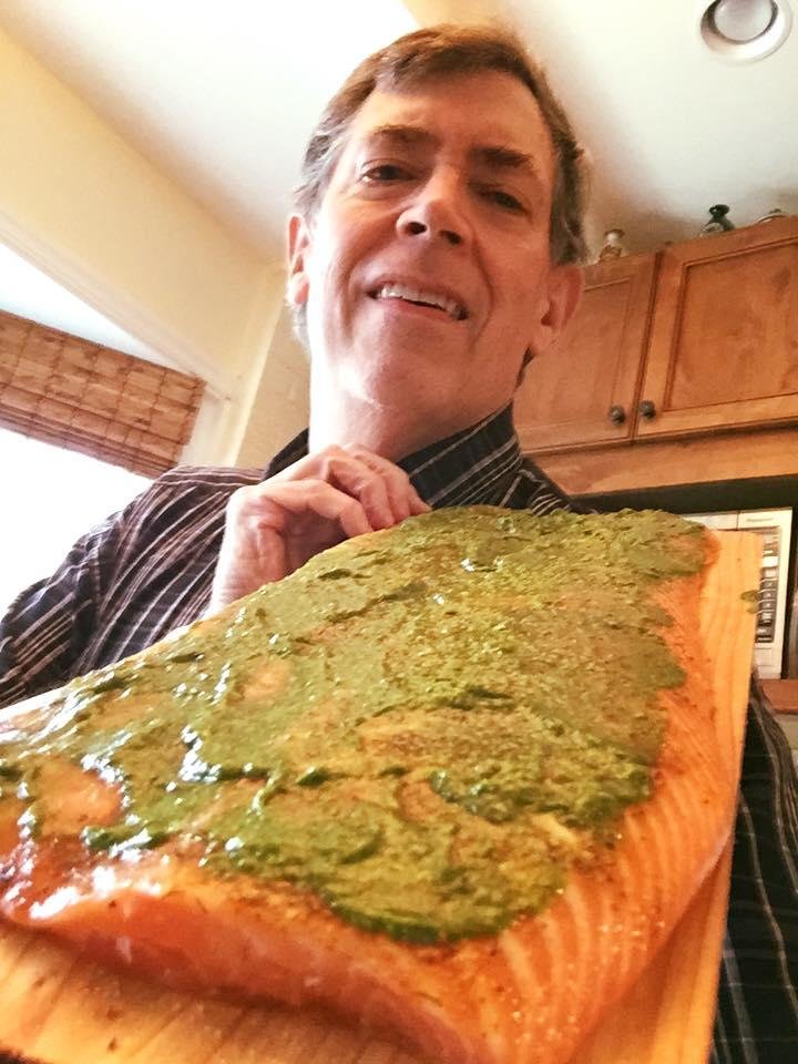 Salmon with a chimichurri glaze on a cedar plank ready to go on the grill!