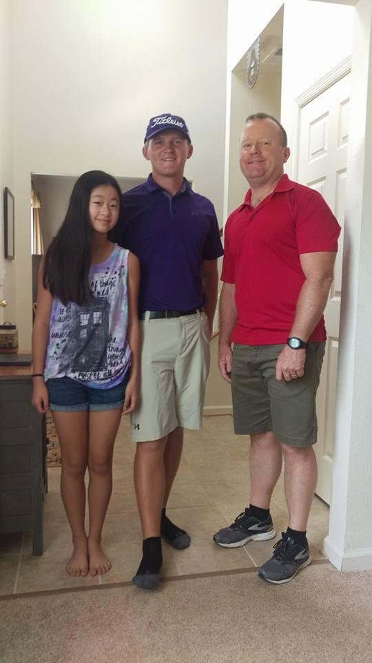 Halle, Noah and Uncle Jack. Noah and Jack are getting ready to go golfing.