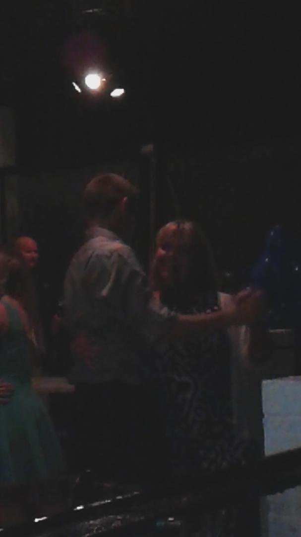 Kelly and her son Cameron dancing at his school dance.