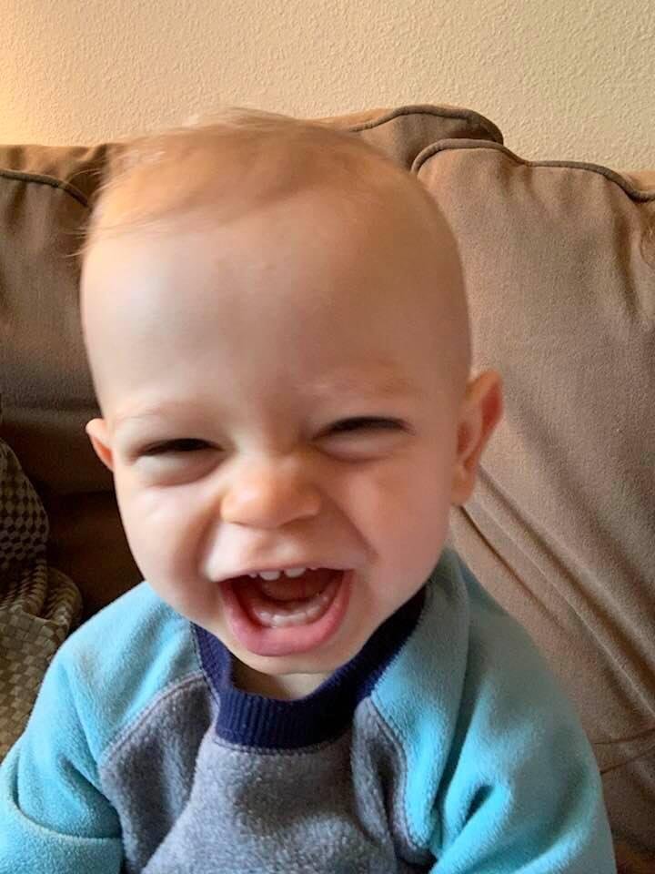 My adorable grandson having a good laugh.