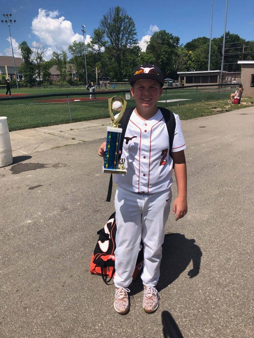 My grandson, Jaden Clem, holding his trophy.