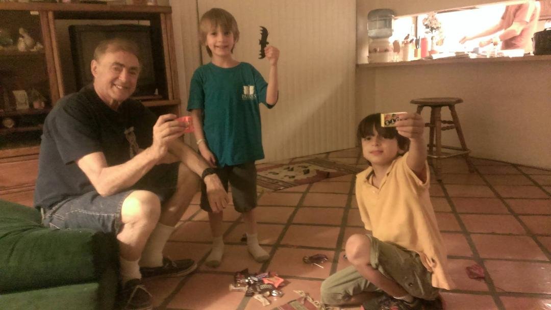 Grandkids over at my house for Halloween. Zachary and Jadon showing a few of their many goodies. I'm holding up one of their treats. I didn't go trick or treating. I figured I'm now too old for that.