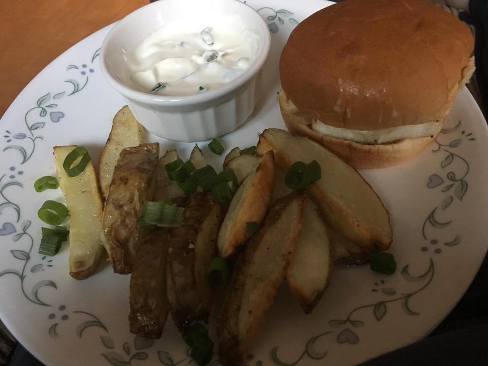 Fresh cod sandwich with homemade potato wedges!  Yummy!