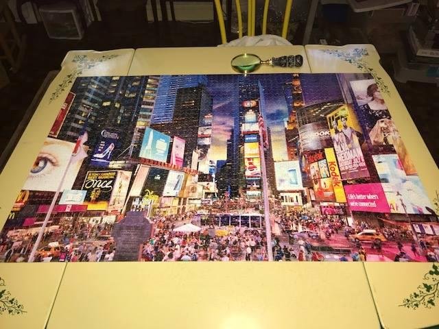 So, this is what we've been doing lately: puzzles! We finished this 2000 piece one of Times Square last night. (Our next one is a 2000 piece Maxfield Parrish picture.) They are incredibly addictive and some nights we end