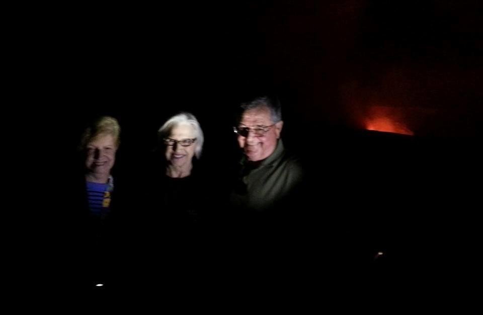 Kilauea after sunset. Our guide used a flashlight to illuminate so you can see our ghostly images in front of Pele's, godess of the volcanoes, glow.