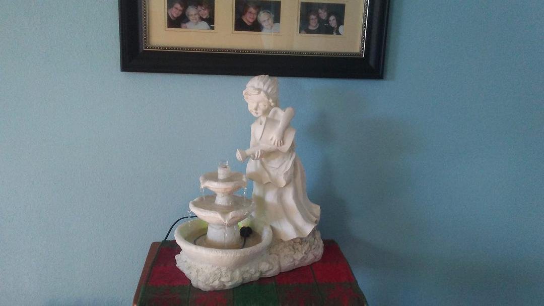 I got a new pump and got my fountain going again. I've missed her.