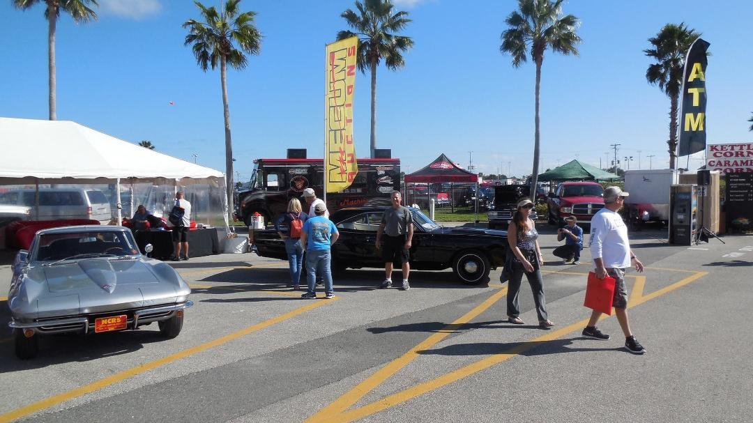 Working the Mecum Auction Information booth at the Daytona Beach Turkey Rod Run. Patrick Ryan in front of a great restored Black 4 speed Hemi Road Runner. This car along with 3,000 others will be in Kissimme from January 16