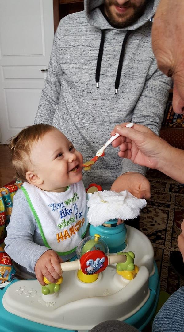 Great grandpa Ed feeding great grandson Grayson. Every time he looks at me he laughs. I must be funny looking. LOL