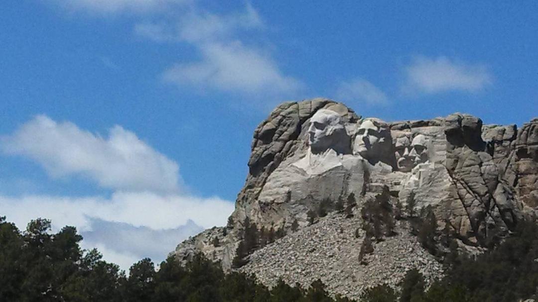 Finally made it to Mt Rushmore! After 14 wind, rain, a wreck, a new trailer and dealing with St Farms worst agent ever! We are here for the next week! See picture. It's not as big as I thought!