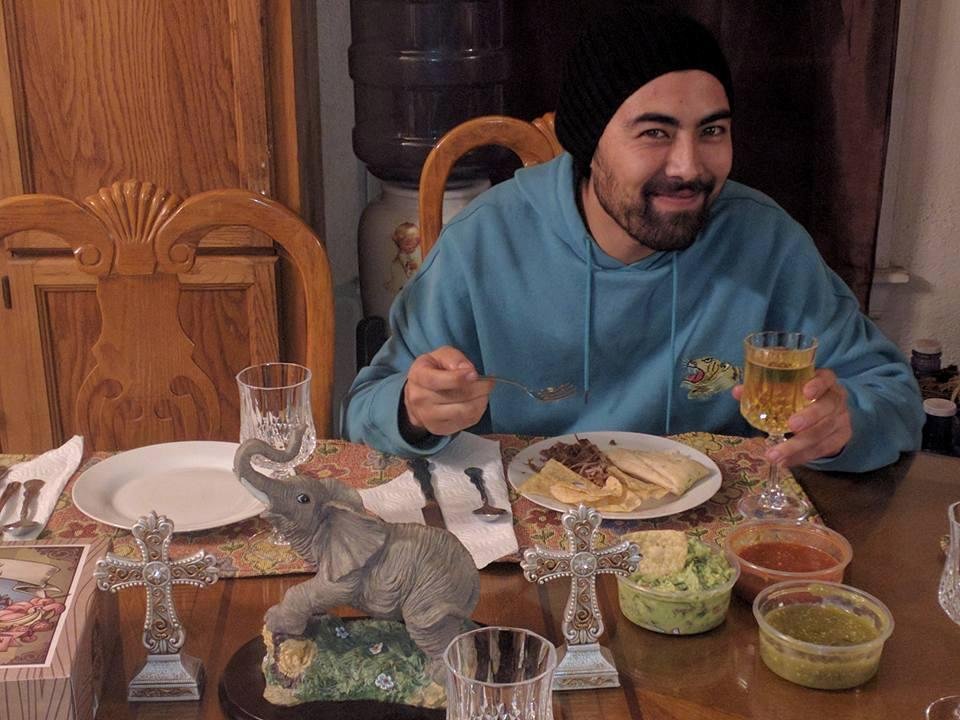 My son Adam enjoying his first tamale of the night. Happy New Year every one!