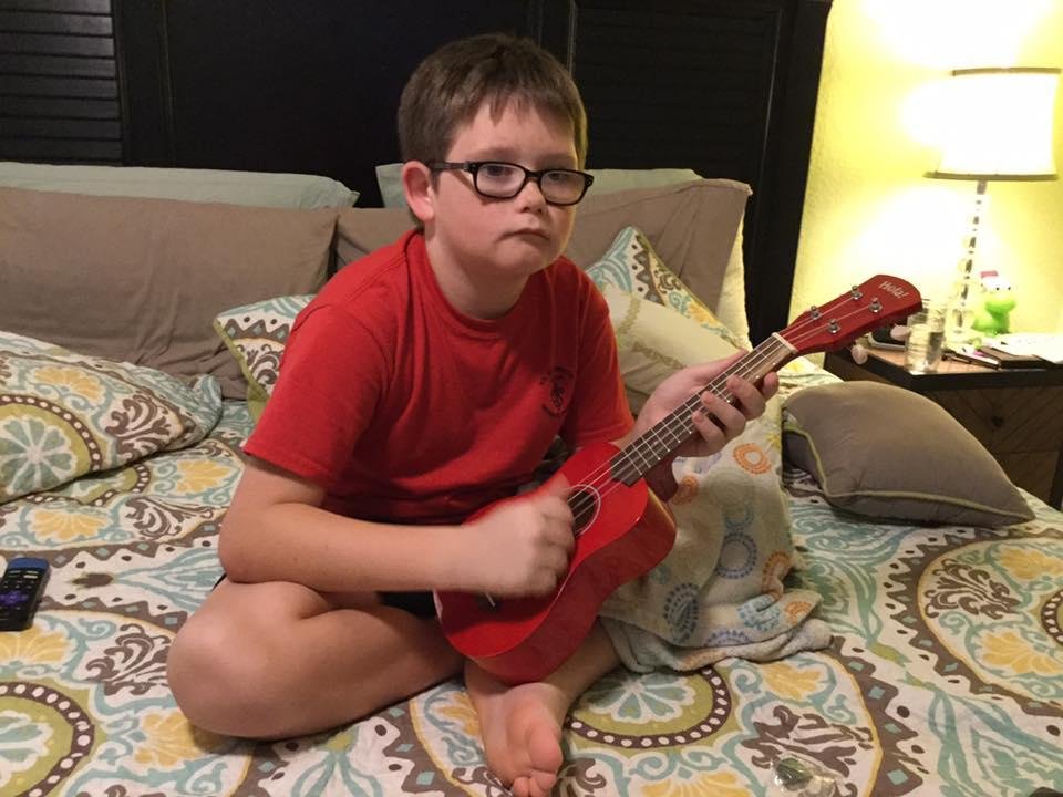 Grandson, Jackson, practicing, his new yukelelel - just turned 10 2 days ago.