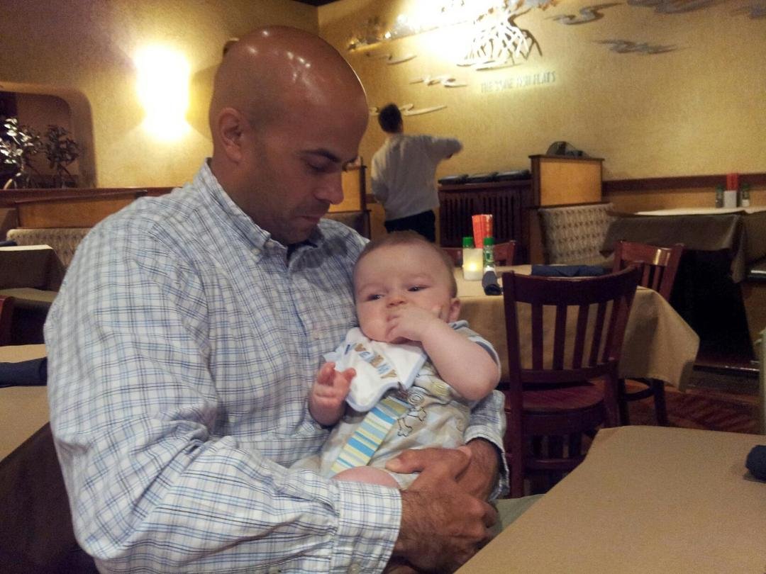 Uncle Shawn holds Logan.