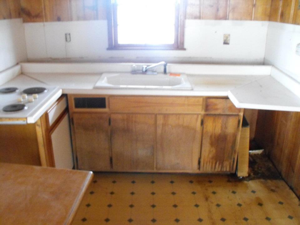 Old Kitchen, got rid of about 75% of this, to install new countertop, stove, sink and hand cabinets. Also removed the old floor to install tile.