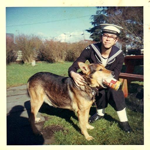My brother, Nathan in his Sea Cadet's uniform with our dog, Rover. He's holding onto the can of dog food that has his name Rover, on it. About 1969. That's our front yard, which is all townhouses now.