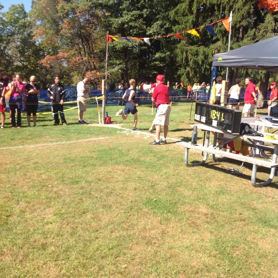 Grandson Grant and time as he crosses the finish line at the "Coaching Legends" Invitational at Huron Meadows Metropark today.