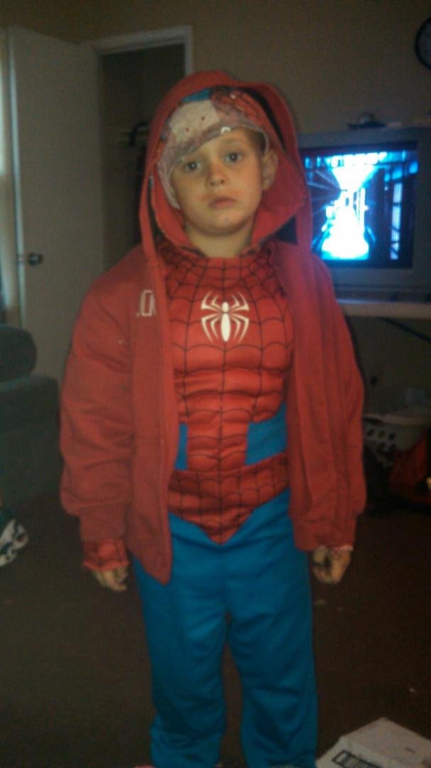Xander all ready for trick or treat. He's not smiling cause I was holding him up, lol.